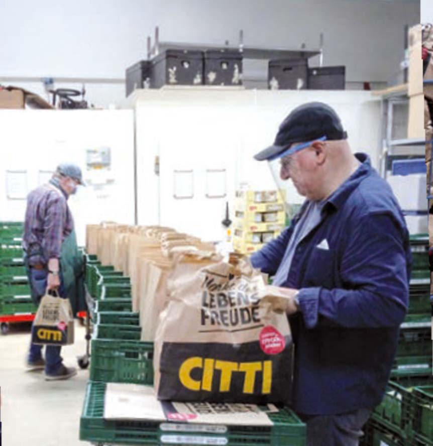 Mann im Lebensmittel Depot der Tafel Kiel